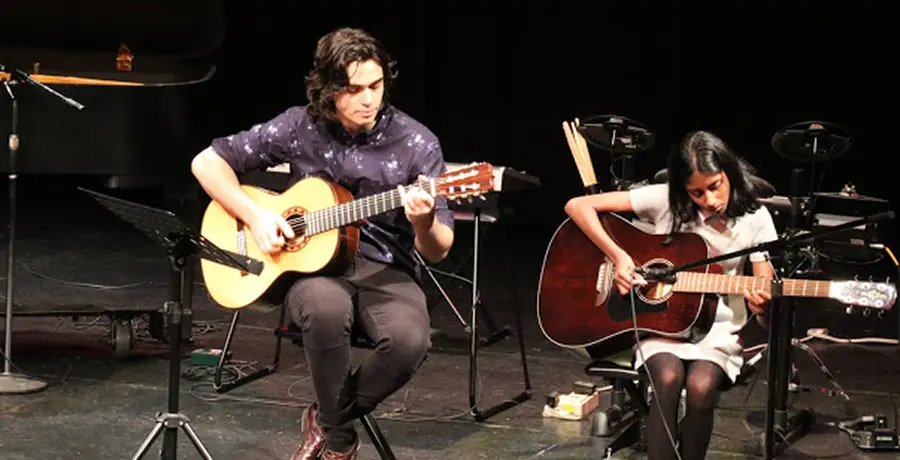 A beginner guitarist playing 